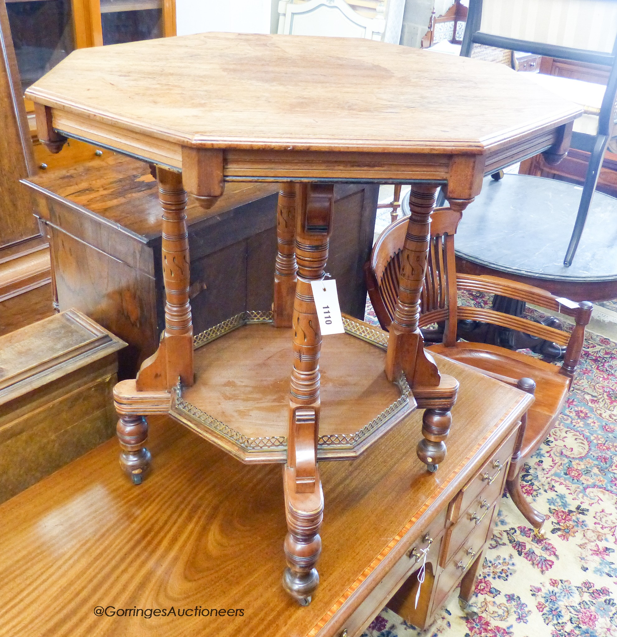 A late Victorian octagonal walnut aesthetic movement two tier centre table, width 68cm, depth 68cm, height 75cm